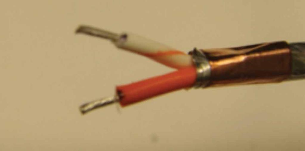15. Using 24-gauge hand strippers, strip each primary (Figure 54). If necessary re-tin the primary ends. 18. Solder each twisted pair into a set of contacts.