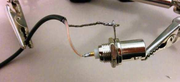 I find that it's easier to tin the coax center lead and fill the BNC center connector with solder (melt solder in it) before trying to solder the coax to the BNC center connector ( Figure 16: Antenna