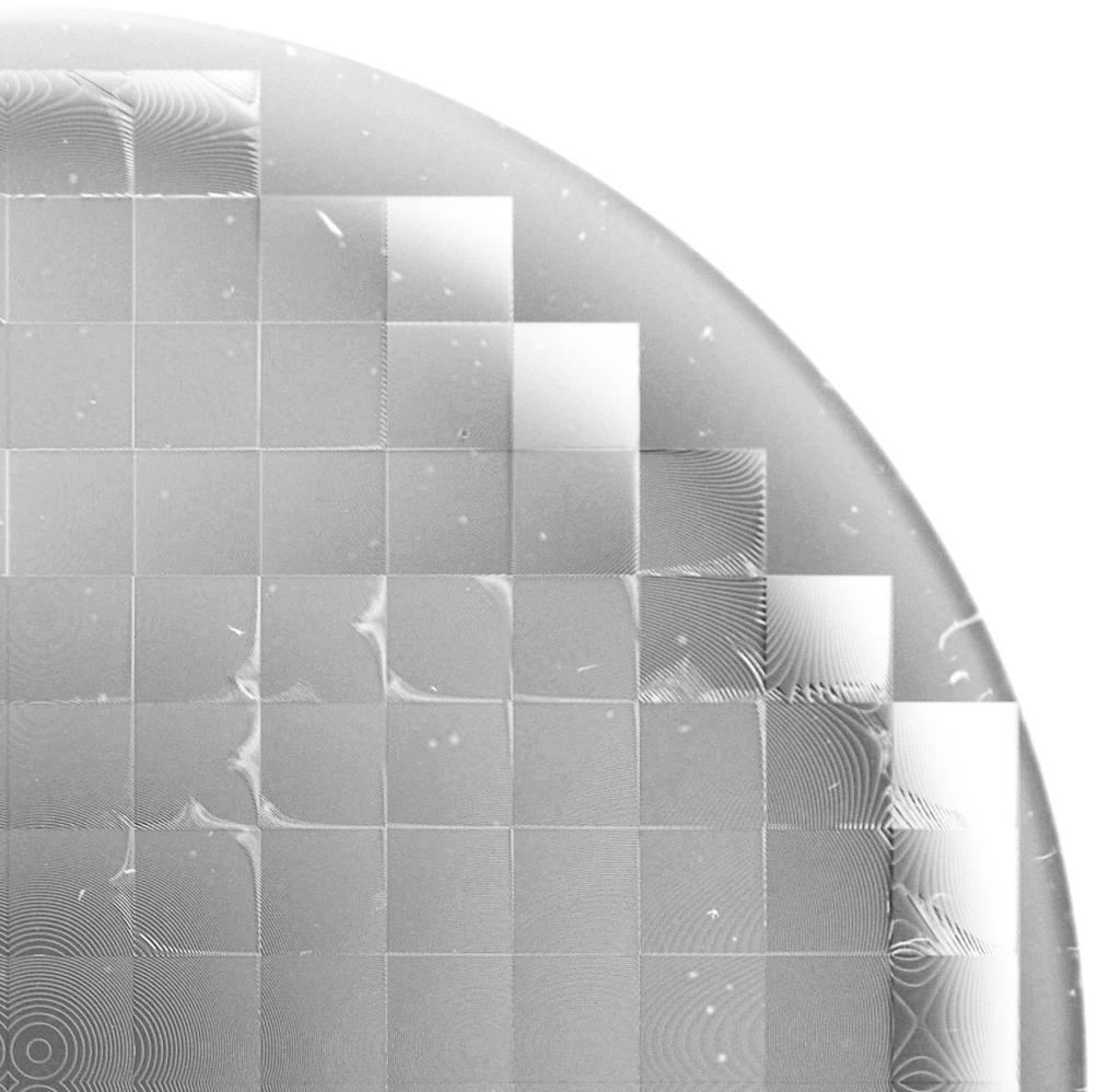 Figure 6. A microscopic picture of a quarter of the manufactured microlens array with visible defects.