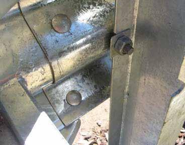 Bolt head and rail 1 to post 1 using the supplied M16 x 50mm (5/8 in x 2 in) guardrail post bolt.