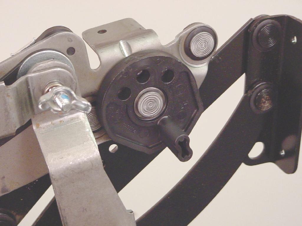 Extend the legrest. Connect the extension spring to the side of the mechanism starting with the front connection.
