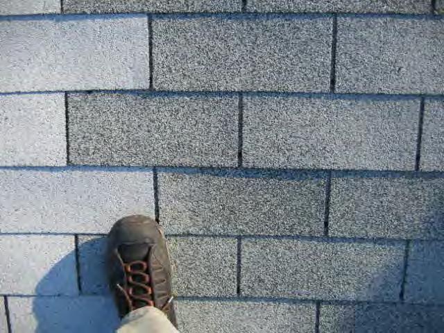 Racking (or vertical installation of shingles) is generally not recommended for asphalt shingles.