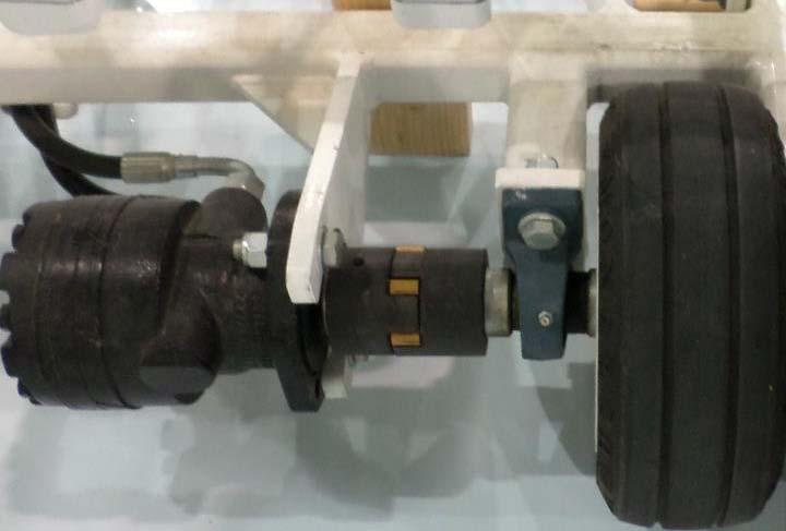 4. Loosen the set screw in the coupling attached to the motor. Figure 4: Motor coupling set screw 5.