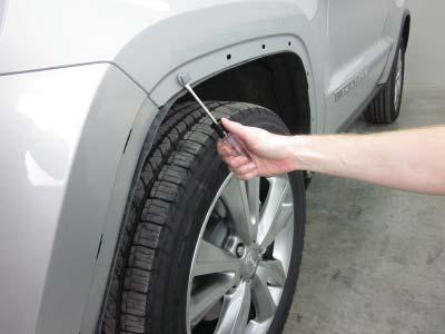 Use a pry tool to remove any remaining factory fasteners that may have stayed on the vehicle