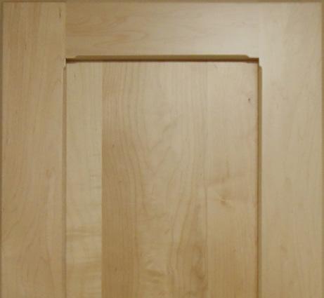 The flat side of this panel faces forward with the raise rising forward toward the back of the door.