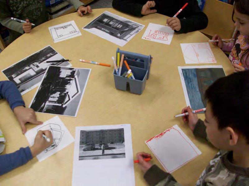 The students examined photographs taken while out on community