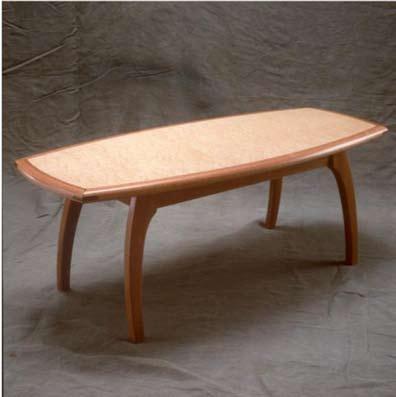 5. Crab Leg Coffee Table This elegant coffee table is made with bird s-eye maple veneer in the top with mahogany legs and frame and wenge corner splices.