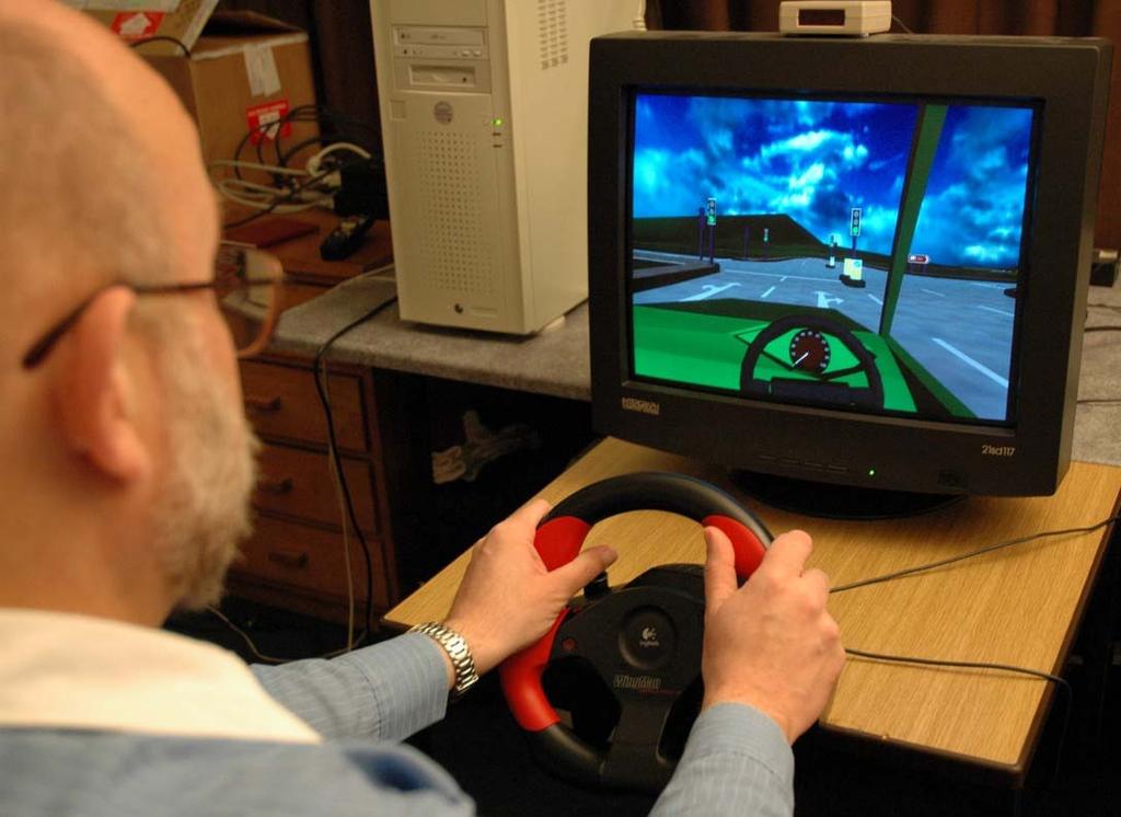 1.2 Equipment and Materials The VR-based driving assessment test was constructed using World-Up software and run on a Duel Xeon PC with a 17 monitor using a Logitech steering wheel, accelerator and