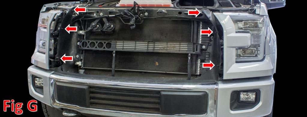 7. Remove the plastic clips holding the rubber shroud to the grille (3 per side),