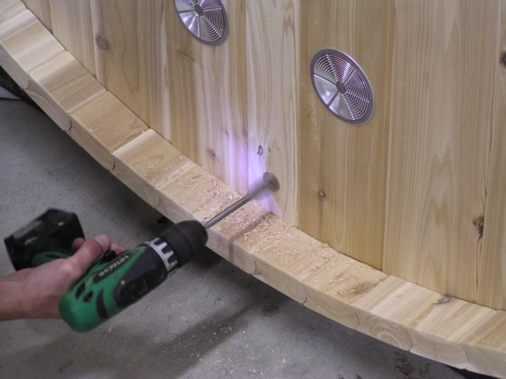 Drill hole in rear of sauna to bring power to