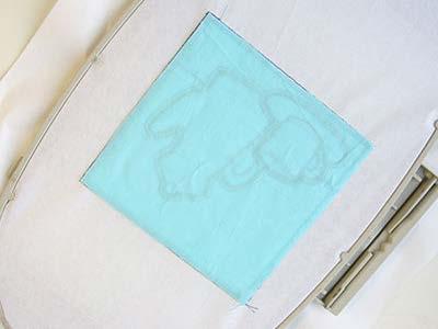 On the color change sheet, look for the note that says "back piece tack down," and stop the