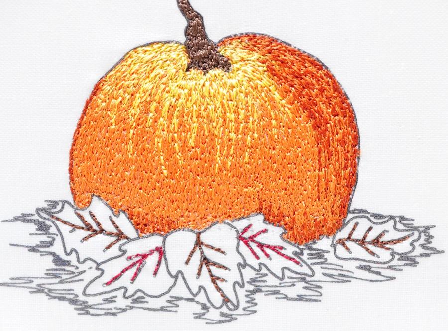 Using the curved lines of the thread already in place, irregularly thread paint some secondary shading to the top of the pumpkin. The threads at the base of the stem should be concentrated. 2.