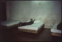 Nan Goldin Brian in hotel room with three beds, Merida, Mexico, 1982, 1982 Silver dye