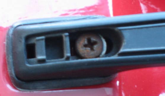 handle towards the rear of the car to lock in place.