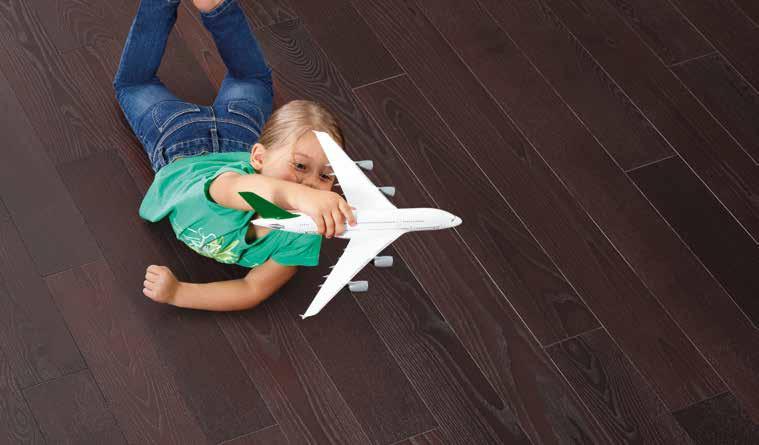 POLYX -OIL AND WOOD WAX FINISH CLEAR EXTRA THIN WOOD STAYS WOOD. NATURAL AND VIVID. AND IT CAN EVEN WITHSTAND LANDING TOY PLANES. CLEAR POLYX -OILS: ALMOST INVISIBLE PROTECTION FOR WOO- DEN FLOORING.
