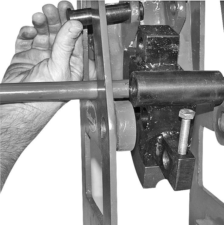 Place Jack Handle through the triangular openings of the frame toward the angled side and in front of the Jack Pivot Pin (Fig D.).