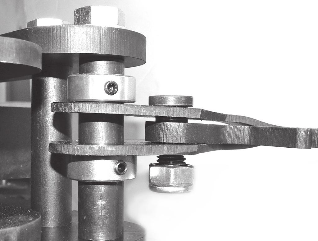 Place the Ø 1 x 4 [Ø 26mm x 102mm] Frame Spacer through the holes in the Ratchet/Lever Sub-ssembly and slip one each of the Shaft Collars (S) on either side with the Ratchet/Lever Sub-ssembly