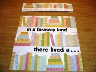 Press your rows and then lay them back out adding the appliqued strips in between each row. Sew the rows together.