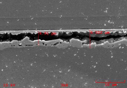 SEM examination also confirmed that the solder layer under those emitters in the white colored region has voids. Figure 6.