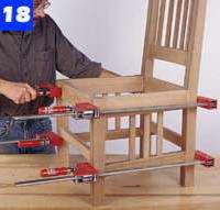 Apply clamps to pull the joints tight. Set the chair upright on a flat worktable to be sure that all four legs sit evenly (Photo 18).
