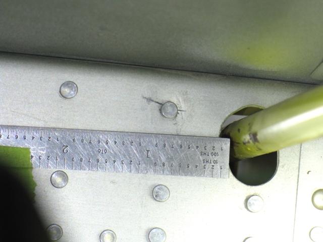 Synopsis: Cracks have been found radiating outward from the lower or upper most rivets that attach the inboard aileron hinge brackets to the webs of the wing rear spars. See Figure 1.