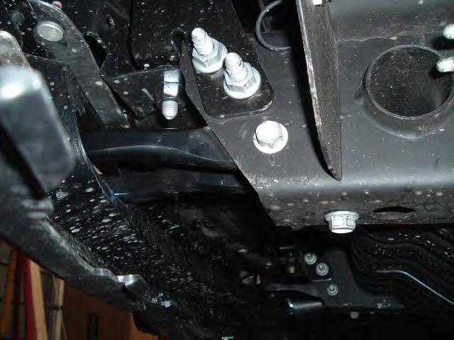 Remove the tow loops by removing the 12mm (18mm wrench) cross bolt and the 12mm bottom bolt from each.