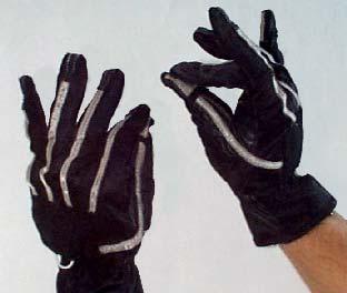 Figure 2.3: FakeSpace s Pinch TM Glove input devices. The gloves have electrical contact points that allow users to make pinch postures that can be then mapped to a variety of tasks.