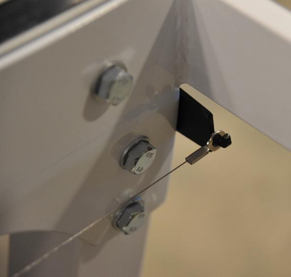 install the X-Axis wire holders as shown in Figure 5. Tighten securely.