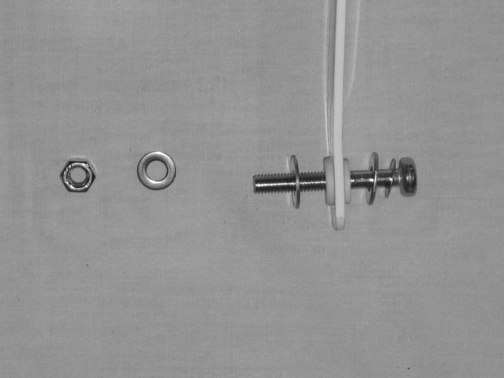 Arrange hardware as follows: screw, small washer, large washer, swing arm, large washer as in Fig. 16.