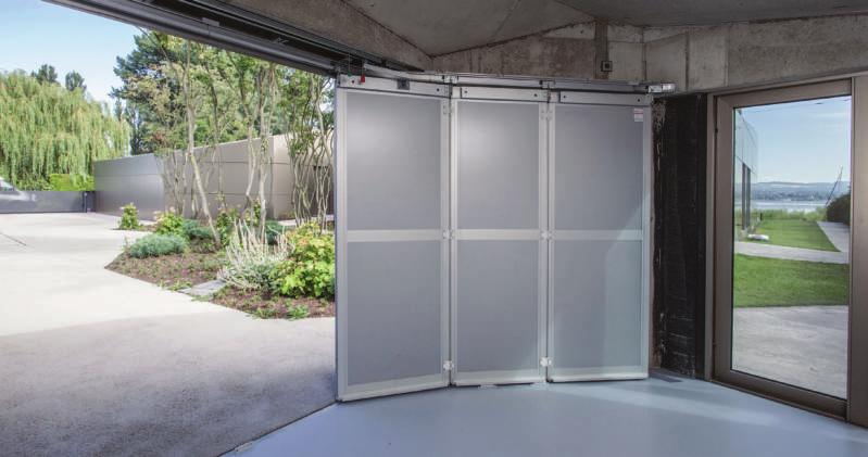 Covering is mounted invisible Side-Sectionaldoor, view from the inside traffic white RAL 9016