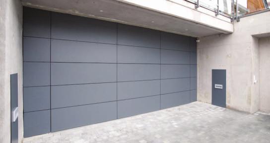 Side-Sectionaldoor private house, smooth panels Sectional doors in various designs For industrial or