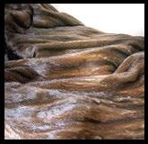 MINK EXPRESSO THROW Mink in full hides. Back in wool, angora and cashmere. This fur is composed of European minks. Indulge in the sumptuous feel of fur with our luxury real fur collection.