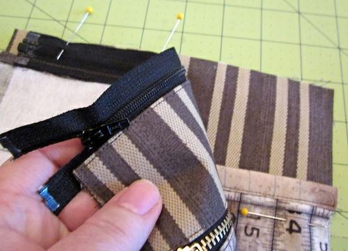 edge of the back panel. 12. Using a ¼" seam, stitch across the panel through both layers (the back Ticking panel and the zipper). 13.