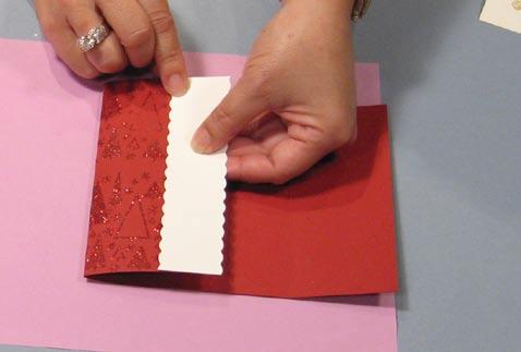 Emboss with Cherry Twinkle embossing powder. Repeat for the right flap. 9 Turn the card over and fold in the left flap.