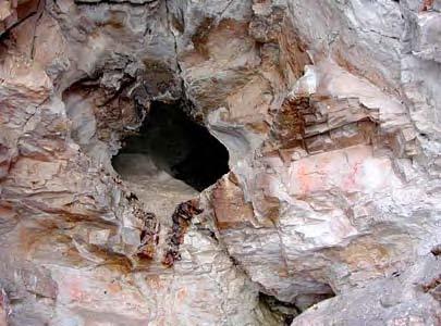 In the lower entrance room of one large cavern are intensive ashy deposits with burned rock, chipped stone tools, debitage, and large amounts of butchered bone that indicate repeated use of the
