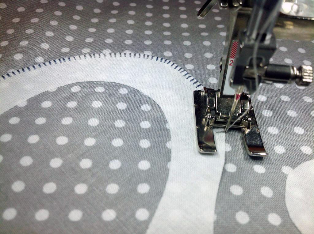 Set your machine for a small blanket (or buttonhole) stitch.
