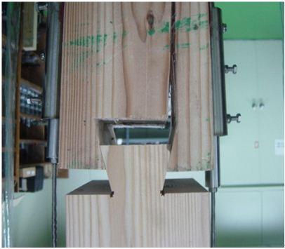 a) Transverse stress x distribution from FEM and tension perpendicular to the grain failure at mortise in dovetail connection, b) Longitudinal stress y