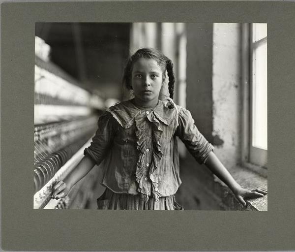 Like Riis, Hind took many photographs of families in tenement