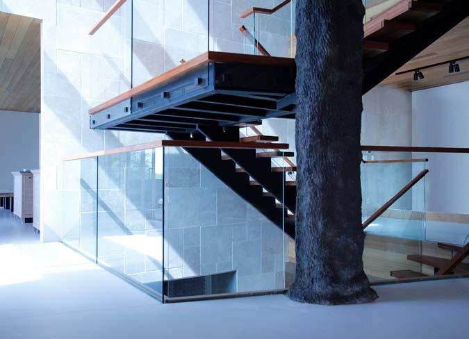 Aesthetic value: Modern open riser design using steel as the support structure with 3 wood treads finished with Starphyre Glass.