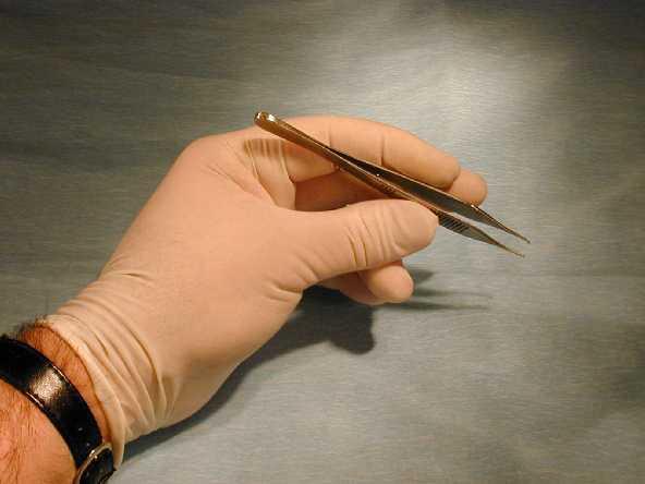 4. The techniques of a Simple Interrupted Suture Small toothed forceps, such as the Addison forceps shown here, should be used to grasp