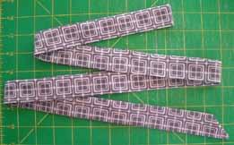 fabric, cut 2 squares 6 1/2" x 6 1/2". ASSEMBLY INSTRUCTIONS The first thing we ll do is make the tie strings and have them ready. You ll need your two 3" x WOF purple strips for this step.