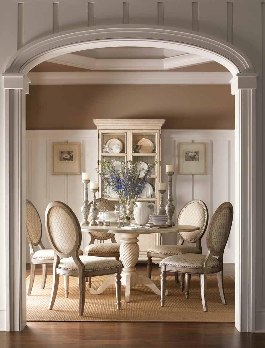 The Barrett Dining Table, with its graceful scalloped edge and elegant twisted pedestal