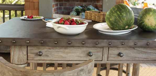 Its burnished stainless steel top is anchored with large pewter