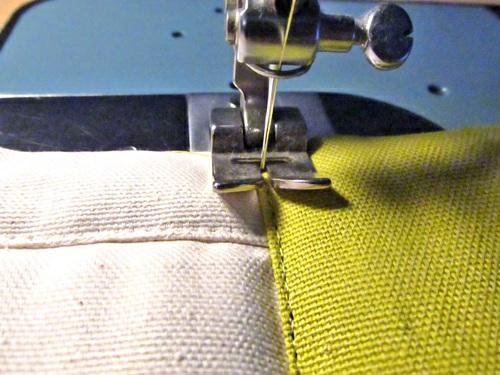 16. Topstitch in place, staying as close as possible to the folded edge. 17. Repeat to attach the remaining 9" strip to the opposite side.