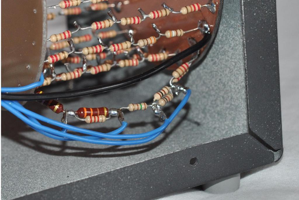 The photograph below shows this resistor chain connected to the 50Ω dummy load. The blue wires lead off to the range switch. The 50Ω resistor was measured, it was found to have a value of 49.6Ω.