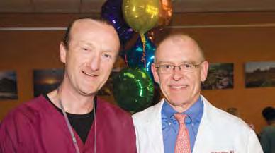 With the staff from the Emergency Department, Patient Centered Services and Volunteer Services gathered around him, David Bell received hugs, thanks and good wishes for his invaluable service.