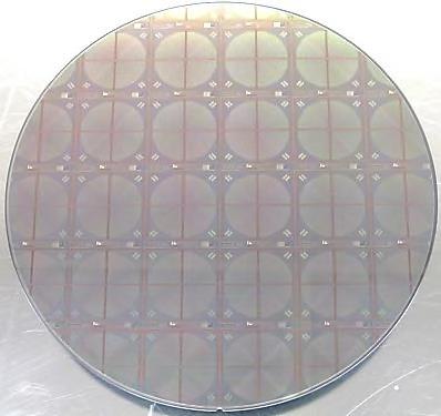 8. Figure 8: Finished front (left side) and back (right side) illuminated CCID87 wafers.
