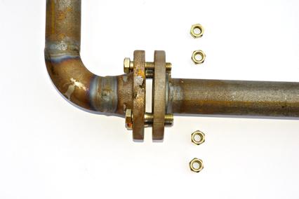 Flanges at an angle. When a flanged pipe is being installed between two mating parts that are already in fixed positions, make sure the flanges are not angled to each other. (See Figure 5 and 6.