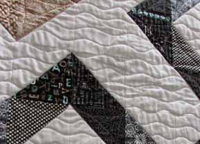 Sew your blocks into rows, and your rows into your quilt top. Back, quilt, bind, and you're done!