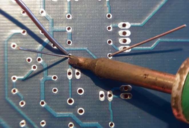 Touch the soldering iron tip to both